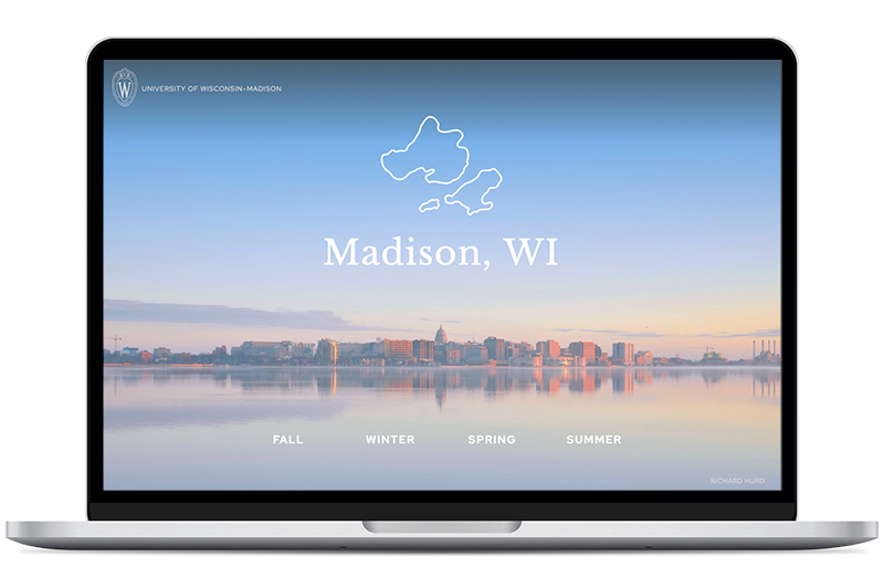 Laptop showing a calm lake, state capitol in the distance, and the words Madison, WI